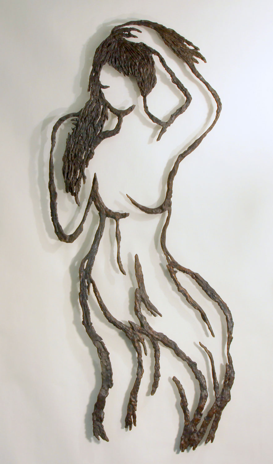 <em>A Girl with a Hairdo</em>, 2011. Cast bronze, 43 x 17 in. (108 x 45 cm)